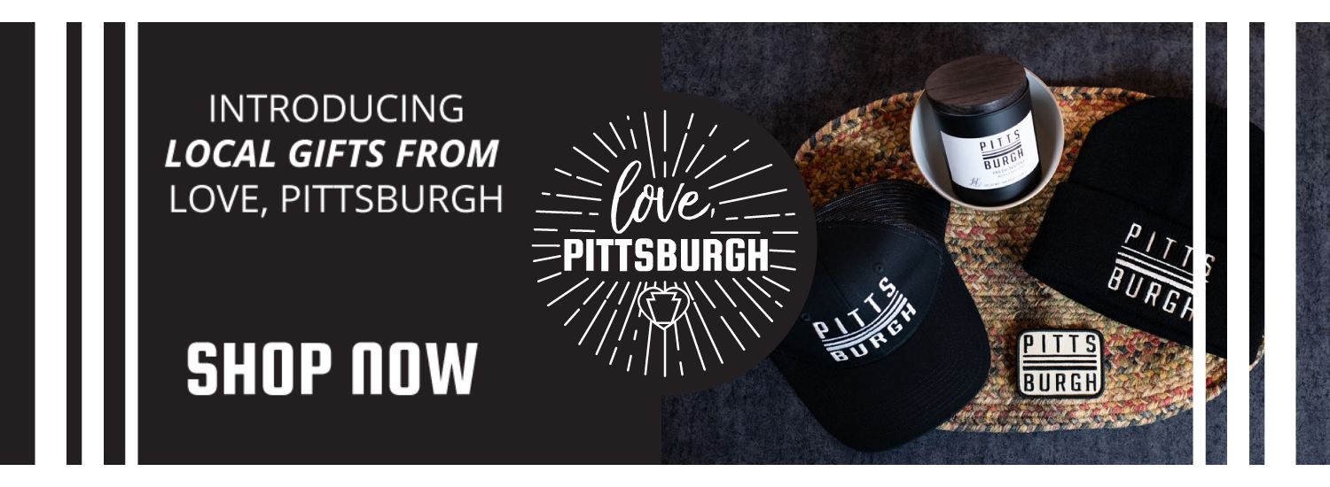black banner with white accent stripes on left and right, with white text that reads Introducing local gifts from Love, Pittsburgh. Shop Now. to the right center is the love pittsburgh logo and photo of love pittsburgh products including a black baseball cap, candle, embroidered patch and black beanie with pittsburgh designs 