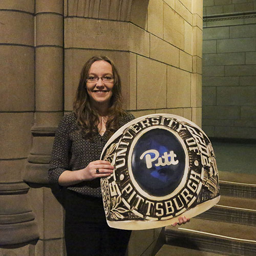 girl holding pitt class ring cutout